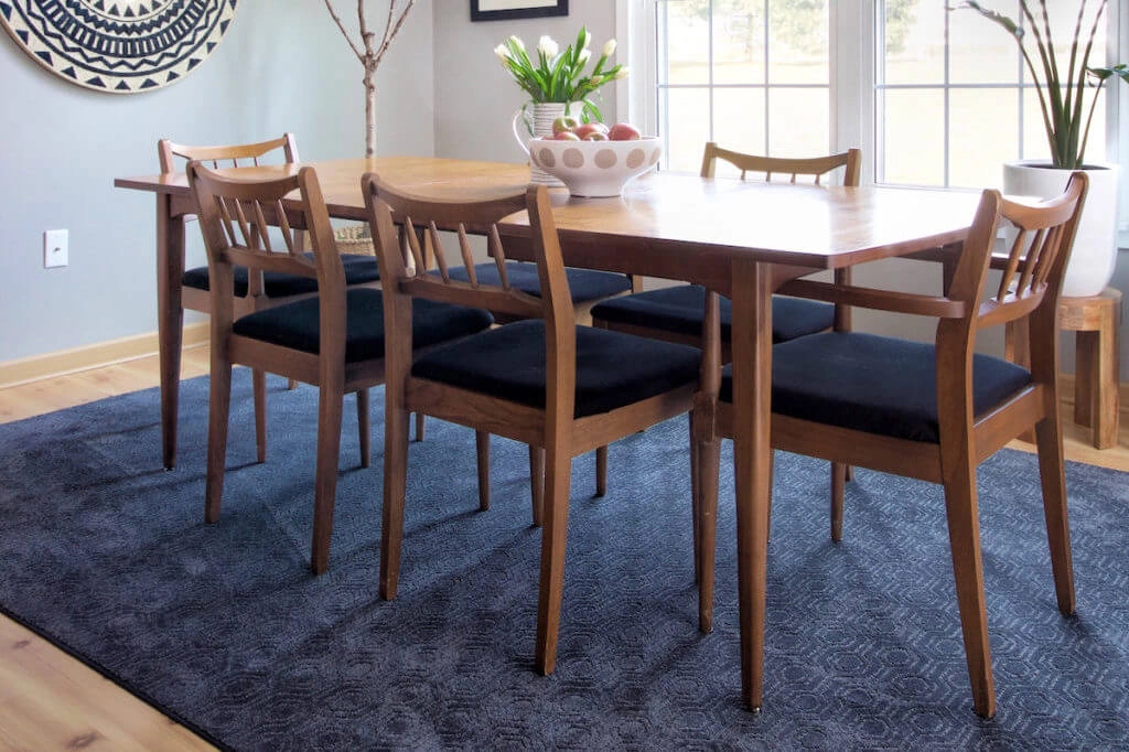 Dining room with blue rug